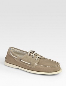 Classically constructed in stretchy canvas, this rugged staple has suede trim and signature laces. Rubber soleImported