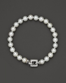 A cultured, freshwater pearl bracelet with a square, diamond clasp. A cultured, freshwater pearl bracelet with a square, diamond clasp.