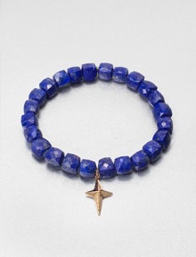 A sparkling diamond charm in 14k gold on a lapis stretch bead bracelet. Lapis14K goldDiamonds, .02 tcwLength, about 6.5Slip-on styleImported A sparkling diamond charm in 14k gold on a lapis stretch bead bracelet. Lapis14K goldDiamonds, .02 tcwLength, about 6.5Slip-on styleImported
