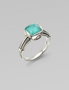 A bright, faceted, crystal accented turquoise stone set in sterling silver on a detailed shank. Crystal accented turquoise doubletSterling silverWidth, about ¼Imported