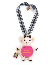 Think pink. Show off your playful side with Betsey Johnson's pink pig picture frame ornament. Accessorized with a bow and pearl necklace and carrying a wrapped present, it's adorned with sparkling crystal accents. Made in gold tone mixed metal, it hangs from a gingham ribbon. Approximate length: 2-3/4 inches. Approximate drop: 4-1/4 inches. Think pink. Show off your playful side with Betsey Johnson's pink pig picture frame ornament. Accessorized with a bow and pearl necklace and carrying a wrapped present, it's adorned with sparkling crystal accents. Made in gold tone mixed metal, it hangs from a gingham ribbon. Approximate length: 2-3/4 inches. Approximate drop: 4-1/4 inches.