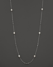 This sterling silver necklace, gleaming with freshwater pearls, makes an elegant statement. By Di MODOLO.