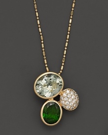 A head-turning cluster of chrome diopside and prasiolite, set in 14K yellow gold.