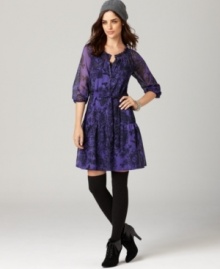 Get romantic with this chic dress from DKNY Jeans! A ruffled skirt, floral lace print and semi-sheer fabric make this look so easy to love. Get romantic with this chic dress from DKNY Jeans! A ruffled skirt, floral lace print and semi-sheer fabric make this look so easy to love.