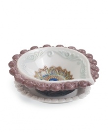 Decorate for Diwali, then enjoy the unparalleled grace of Lladro porcelain all year long with this handcrafted diya. With a colorful floral motif and swirls of purple and aqua. Decorate for Diwali, then enjoy the unparalleled grace of Lladro porcelain all year long with this handcrafted diya. With a colorful floral motif and swirls of purple and aqua.