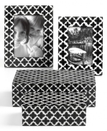 In classic black and white hues, this Purva jewelry box set will easily coordinate with any room decor. Features a floral-inspired quatrefoil design for a chic allure. In classic black and white hues, this Purva jewelry box set will easily coordinate with any room decor. Features a floral-inspired quatrefoil design for a chic allure.