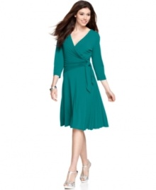 Donna Morgan does something a little different with this stylish faux-wrap dress-she adds a burst of pleating at the one side of the bodice and skirt for a pop of texture. Donna Morgan does something a little different with this stylish faux-wrap dress-she adds a burst of pleating at the one side of the bodice and skirt for a pop of texture.