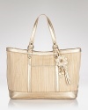 Give you day-to-day look a St. Tropez-inspired twist with Cole Haan's straw tote. When it's a stay-cation, this textured bag loves a sun-dress and sandals.