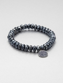 From the Discs Collection. A faceted, almandine garnet beaded bracelet accented with a sapphire accented black rhodium charm. Almandine garnetBlack rhodiumSapphireLength, about 6.5Slip-on styleImported From the Discs Collection. A faceted, almandine garnet beaded bracelet accented with a sapphire accented black rhodium charm. Almandine garnetBlack rhodiumSapphireLength, about 6.5Slip-on styleImported