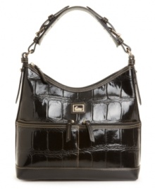 Two handy front pockets add zip to the glossy croc-embossed patent leather sac purse by Dooney & Bourke. Two handy front pockets add zip to the glossy croc-embossed patent leather sac purse by Dooney & Bourke.