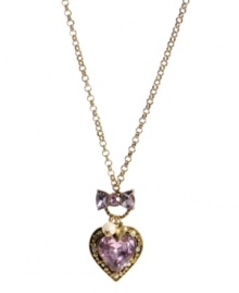 Add a little romance to your look. This flirty style by Betsey Johnson features a trendy longer chain that highlights a heart-shaped pink crystal with bow and glass pearl accents. Setting and chain crafted in antique gold tone mixed metal. Approximate length: 29-1/2 inches. Approximate drop: 2-1/4 inches.