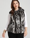 Embrace the season's fur and faux fur trend with this plush two-tone vest--a must-have for your quick glamour fix.