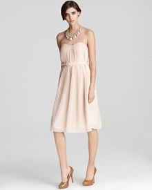 This ladylike French Connection dress is subtly seductive with a strapless neckline and low cut back. Wear it to an evening affair, or toss on a cardigan for a beautiful business lunch look. This ladylike French Connection dress is subtly seductive with a strapless neckline and low cut back. Wear it to an evening affair, or toss on a cardigan for a beautiful business lunch look.