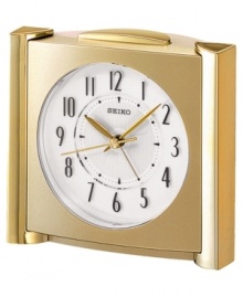 Set this distinguished clock upon any table, desk or mantle for an easy touch elegance. Goldtone mixed metal case. Round white dial with logo and numeral indices. Ascending alarm with snooze. One AA battery included. Measures approximately 7 x 4-2/5 x 4-1/5 inches.  One-year limited warranty.