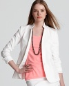 A white Theory blazer is summer's sharpest look--polished over bright tops and button-downs and complete with matching pants and skirts. This iteration is rendered with a hint of stretch, promising to retain its fit through the season and beyond.