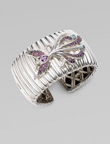 A substantial textural cuff adorned with a bird encrusted in amethyst, rhodolite and Swiss blue topaz. Sterling silver Amethyst Rhodolite Swiss blue topaz Kick mechanism closure Diameter, about 2½ Width, about 1½ Imported 