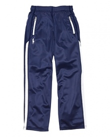 The essential track pant rendered in crisp, water-resistant microfiber styled with pieced racing stripes down the legs for a timeless athletic look. The essential track pant rendered in crisp, water-resistant microfiber styled with pieced racing stripes down the legs for a timeless athletic look.