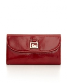 Patent leather adds glossy shine to Dooney & Bourke's sophisticated continental wallet. Patent leather adds glossy shine to Dooney & Bourke's sophisticated continental wallet.