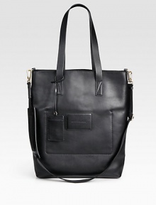 A spacious design crafted in smooth, supple leather with a detachable, adjustable shoulder strap and interior zip pocket.Double top handlesAdjustable shoulder strapIdentification tagInterior zip pocketLeather13 x17 x 3Imported