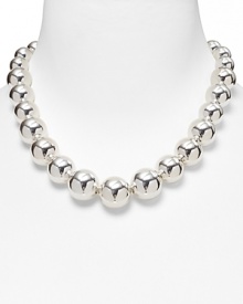 A single strand of metallic beads, graduated from small to large for a sleek, sophisticated silhouette.