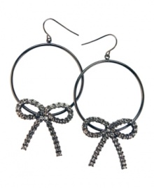 Sweeten up everyday hoops with this version by GUESS. Dark, hematite-plated hoops adorned with crystallized bows. Earrings crafted from mixed metal. Approximate drop: 2 inches. Sweeten up everyday hoops with this version by GUESS. Dark, hematite-plated hoops adorned with crystallized bows. Earrings crafted from mixed metal. Approximate drop: 2 inches.