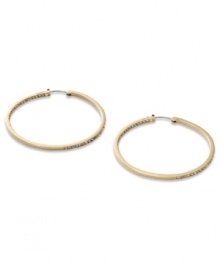 These timeless hoop earrings from Fossil get a glitzy upgrade with black diamond crystal accents. Crafted in shiny gold tone mixed metal. Approximate diameter: 2 inches.