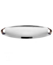 Polished aluminum alone makes Rivet serveware a standout, but with contrasting bronze handles and a sleek yet generously proportioned silhouette, this Dansk oval server embodies modern sophistication. Polished aluminum alone makes Rivet serveware a standout, but with contrasting bronze handles and a sleek yet generously proportioned silhouette, this Dansk oval server embodies modern sophistication.