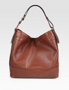 An effortlessly chic roomy silhouette made of rich, butter-soft leather. Single shoulder strap, 10 dropMagnetic snap closureProtective metal feetOne inside zip pocketTwo inside open pocketsFully lined14W X 13½H X 6½DMade in Italy An effortlessly chic roomy silhouette made of rich, butter-soft leather. Single shoulder strap, 10 dropMagnetic snap closureProtective metal feetOne inside zip pocketTwo inside open pocketsFully lined14W X 13½H X 6½DMade in Italy