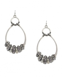 Hip hoop hooray! Featuring a unique oval double-drop silhouette, Jessica Simpson's earrings will stand out as a trendy addition to your wardrobe. Embellished with glittering glass accents, they're set in silver tone mixed metal. Approximate drop: 3 inches.