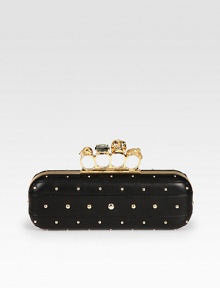 Chic studs on supple nappa leather with a skull accented knuckle duster closure.Knuckle duster top clasp closureLeather lining8¾W X 3H X 1½DMade in Italy Chic studs on supple nappa leather with a skull accented knuckle duster closure.Knuckle duster top clasp closureLeather lining8¾W X 3H X 1½DMade in Italy