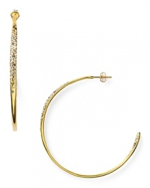 Alexis Bittar's rose gold-plated hoops are a striking example of the label's contemporary edge. With a fluid shape and crystal detailing, these earrings are a style-setting final touch.