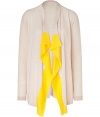 Chic cardigan in pure, beige cashmere - Supremely soft and cozy - Newer silhouette is long, with an on-trend, angular hem - Draped, open style features vibrant, lemon yellow trim - Long, fitted sleeves and gentle fabric gathering at back - Polished, flattering and versatile, ideal for both work and leisure - Wear in lieu of a blazer with a pencil skirt at the office, or pair with skinny jeans and a t-shirt on weekends