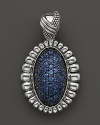 Shining blue sapphires are trimmed in fluted sterling silver on this Lagos pendant.