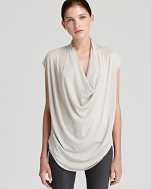 A chic draped neckline brings effortless elegance to this voluminous Helmut Lang top. A chic draped neckline brings effortless elegance to this voluminous Helmut Lang top.