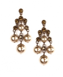 Exquisitely crafted with mocha glass pearls and smokey quartz-colored crystals, Givenchy's chandelier earrings will add elegance to a variety of fashionable fall looks. Set in brown gold tone mixed metal. Approximate drop: 2-1/8 inches.