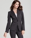 Work sophisticated chic in the boardroom with this DKNYC one-button jacket. Pair with sleek trousers to finish.