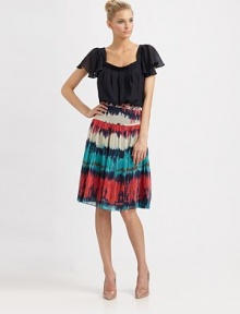 A darling pleated and ruffled top that adds a dash of feminine glamour to every outfit.Square neckShort sleeves with rufflesPull-on styleAbout 23 from shoulder to hemSilkDry cleanMade in USA of imported fabric A darling pleated and ruffled top that adds a dash of feminine glamour to every outfit.Square neckShort sleeves with rufflesPull-on styleAbout 23 from shoulder to hemSilkDry cleanMade in USA of imported fabric