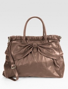 A supple leather style with an iconic bow accent and sweet romantic flair.Double top handles, 7 dropDetachable adjustable shoulder strap, 21-23 dropMagnetic snap closureOne inside zip pocketTwo inside open pocketsCotton lining14W X 9H X 2DMade in Italy