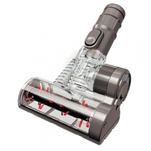 The Dyson Mini turbine head has an air-driven high-speed brush bar that removes dust, dirt and pet hair from tight spaces such as upholstery, stairs and inside the car. The Dyson Mini turbine head has an air-driven high-speed brush bar that removes dust, dirt and pet hair from tight spaces such as upholstery, stairs and inside the car.