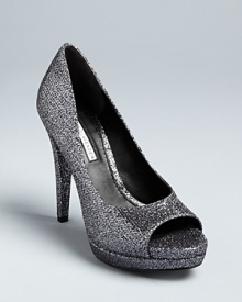 Vera Wang Lavender Label offers a perfect take on the peep toe evening pump style, in luxurious, glittering fabric that will work with denim or dresses. Vera Wang Lavender Label offers a perfect take on the peep toe evening pump style, in luxurious, glittering fabric that will work with denim or dresses.