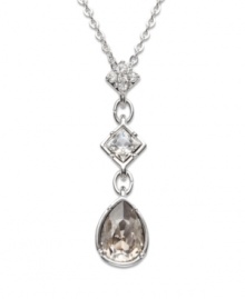 A long and elegant pendant that spells femininity all the way! Clear Swarovski crystals set in pavé gleam on the top square. Another square element sports a clear, bezel-set crystal, and a satin crystal dangles gently at the base. Crafted in silver tone mixed metal. Approximate length: 15 inches. Approximate drop: 1-3/16 inches. A long and elegant pendant that spells femininity all the way! Clear Swarovski crystals set in pavé gleam on the top square. Another square element sports a clear, bezel-set crystal, and a satin crystal dangles gently at the base. Crafted in silver tone mixed metal. Approximate length: 15 inches. Approximate drop: 1-3/16 inches.