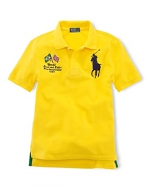 A preppy short-sleeved polo shirt in breathable cotton mesh is accented with country embroidery. A preppy short-sleeved polo shirt in breathable cotton mesh is accented with country embroidery.