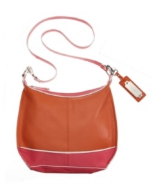 Take the colorblock trend by storm! This versatile crossbody bag from Tignanello features a colorblock body, shiny silvertone hardware and a polished signature charm. Take the colorblock trend by storm! This versatile crossbody bag from Tignanello features a colorblock body, shiny silvertone hardware and a polished signature charm.
