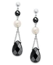 Ebony and ivory. Cultured freshwater pearls (6-1/2-7 mm) and faceted onyx (9 mm x 13 mm and 5 mm) create an elegant look on these dangling sterling silver earrings. Approximate drop: 1-3/4 inches. Ebony and ivory. Cultured freshwater pearls (6-1/2-7 mm) and faceted onyx (9 mm x 13 mm and 5 mm) create an elegant look on these dangling sterling silver earrings. Approximate drop: 1-3/4 inches.