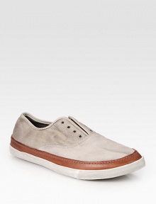 Roughened by a laceless front, contrasting leather trim adds a two-tone touch to this soft cotton and suede design. Leather liningPadded insoleRubber soleImported