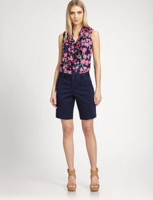 A playful, colorful flower print adorns this sweet, ruffled style.V necklineRuffled trimSleevelessConcealed front button closuresPolyesterMachine washImportedModel shown is 5'10 (177cm) wearing US size Small. A playful, colorful flower print adorns this sweet, ruffled style.V necklineRuffled trimSleevelessConcealed front button closuresPolyesterMachine washImportedModel shown is 5'10 (177cm) wearing US size Small.