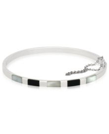 The essence of style and elegance, polished bangle looks stunning solo as well as layered with other bangles. Crafted in sterling silver with rectangular accents in onyx and Mother of Pearl. Approximate diameter: 2-5/16 x 2-5/8 inches.