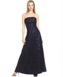 Calvin Klein's evening gown is classic and elegant with a strapless silhouette and a gorgeous lace overlay. Calvin Klein's evening gown is classic and elegant with a strapless silhouette and a gorgeous lace overlay.