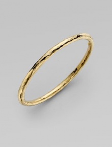 From the Martellato Collection. A luminous accent for the wrist is designed with the unique hammered look of 18k yellow gold. Chic to wear alone or doubled up with others. 18k yellow gold Diameter, about 3 Made in Italy 