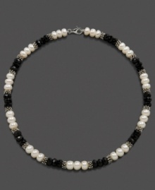 Light and dark, juxtaposed perfectly. Triplets of cultured freshwater pearl (8-9 mm) and faceted onyx beads (8 mm) alternate with sterling silver beads to create a stunning necklace. Set in sterling silver. Approximate length: 18 inches. Light and dark, juxtaposed perfectly. Triplets of cultured freshwater pearl (8-9 mm) and faceted onyx beads (8 mm) alternate with sterling silver beads to create a stunning necklace. Set in sterling silver. Approximate length: 18 inches.
